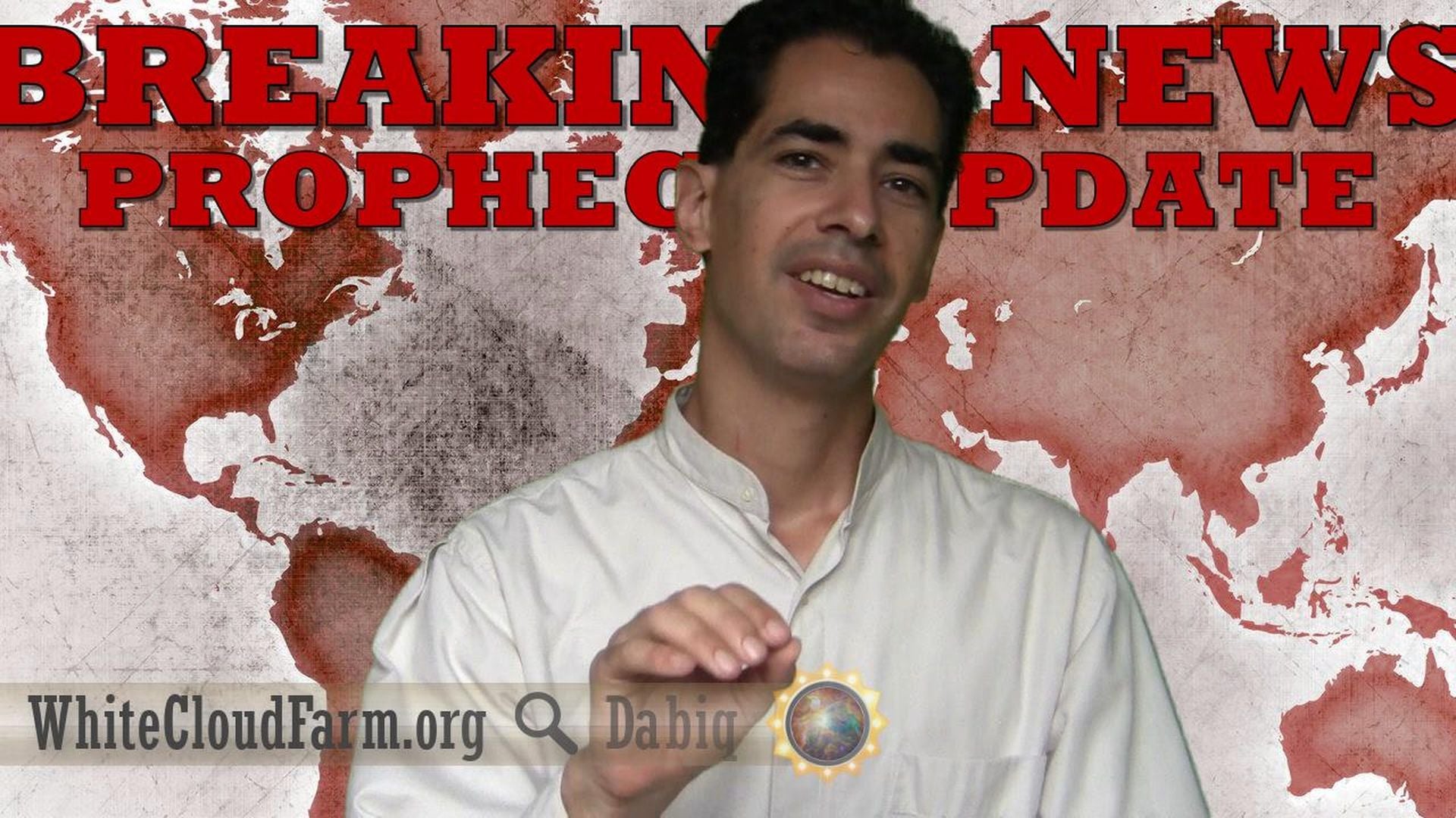4. BREAKING: U.N. Gets Keys to Raqqa, Fulfilling Prophecy. A man in a white robe smiles, gesturing with his hand toward the camera, against a backdrop displaying the world map in red shades and the words "BREAKING NEWS PROPHECY UPDATE." The logos "WhiteCloudFarm.org" and "Dabiq" are visible, along with a small colorful emblem resembling a celestial design related to the Mazzaroth. Opens a video in a new window.