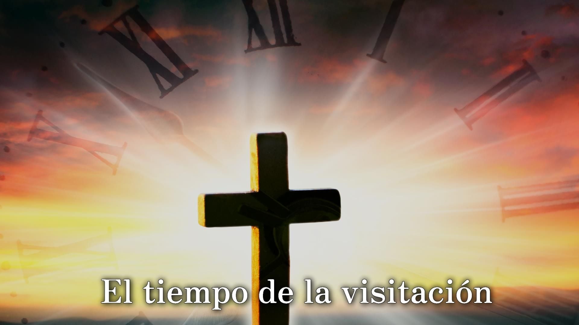 5. El tiempo de la visitación. An illustration of a wooden cross centered against a vibrant sunset sky, with beams of light radiating outward and subtle patterns symbolizing the Mazzaroth in the background. The Spanish phrase "El tiempo de la visitación" appears at the bottom. Opens a video in a new window.
