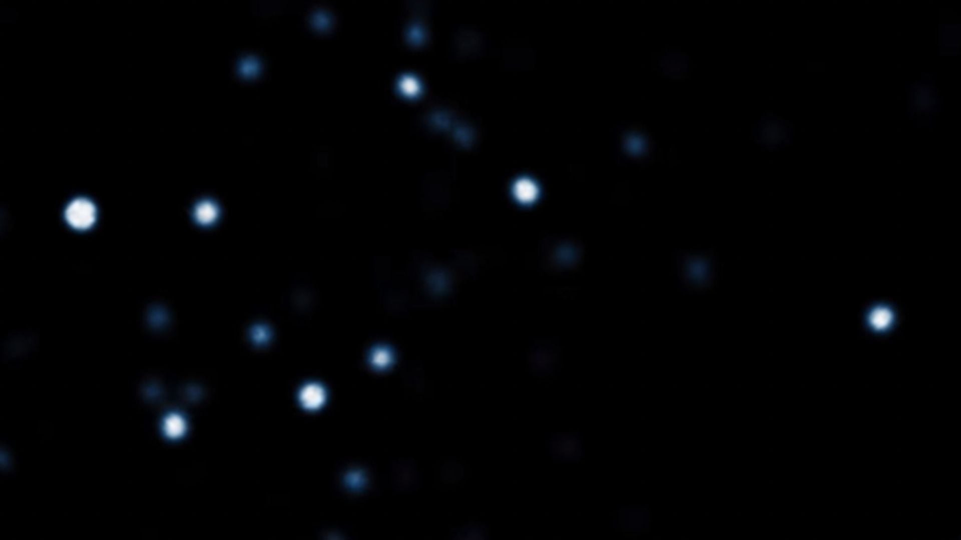 3. Eine Reise in das Herz der Milchstraße. A celestial view capturing a cluster of stars in the cosmos, glowing brightly against the backdrop of deep space. Opens a video in a new window.
