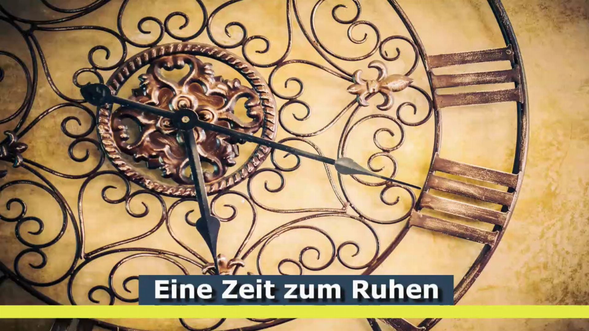 1. Eine Zeit zum Ruhen. Decorative clock with ornate metalwork featuring a central floral design, set against a vintage-style illustrated background with Roman numerals. The clock hands are pointing to just after twelve. German text "Eine Zeit zum Ruhen" translates to "A Time to Rest" in English. Opens a video in a new window.