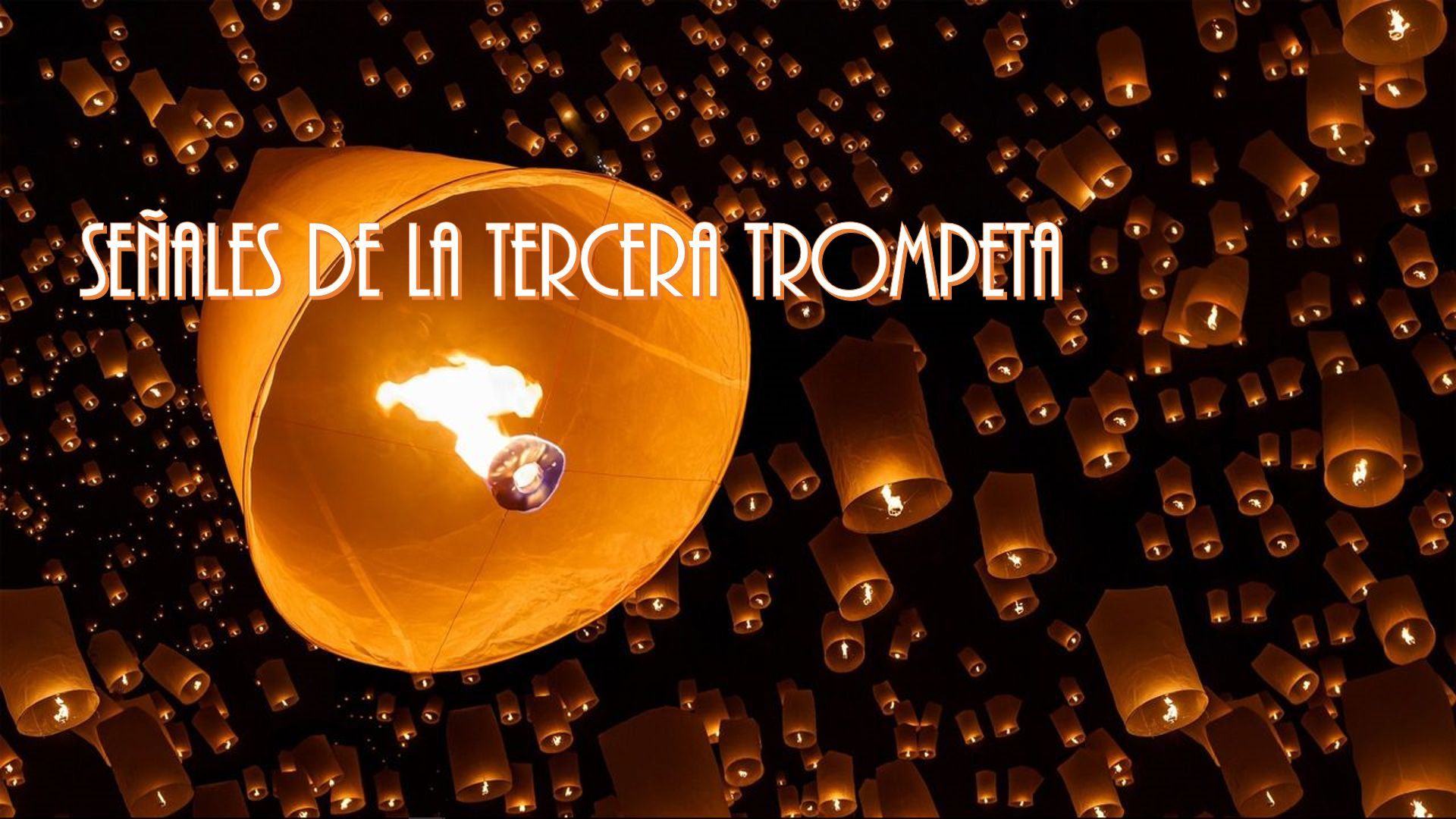 6. Señales de la tercera trompeta. A night sky illuminated by numerous floating lanterns, with a prominent lantern in the center displaying the text "Señales de la tercera trompeta" and bearing a map silhouette of South America highlighted by a glowing gem-like light. Opens a video in a new window.