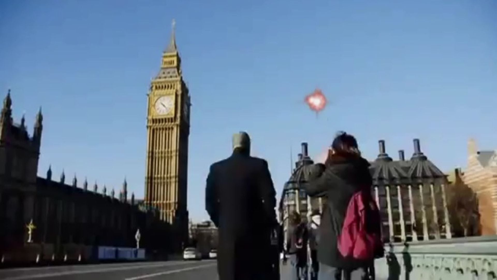 4. The Universe: Biggest Blasts (supernova blasts) - Documentary HD 1080p. A group of people on a bridge, observing a bright unidentified aerial phenomenon in the shape of a heart above them, with the iconic Big Ben and the British Parliament buildings in the backdrop under a clear blue sky. Opens a video in a new window.