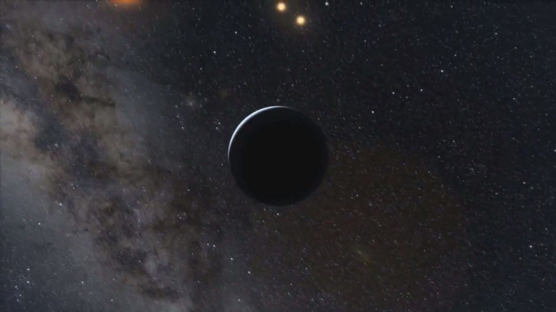 10. The Detailed Universe. A celestial body with a dark silhouette passes before a dense field of stars and a nebula, illustrating the vast mysteries of the universe. Opens a video in a new window.