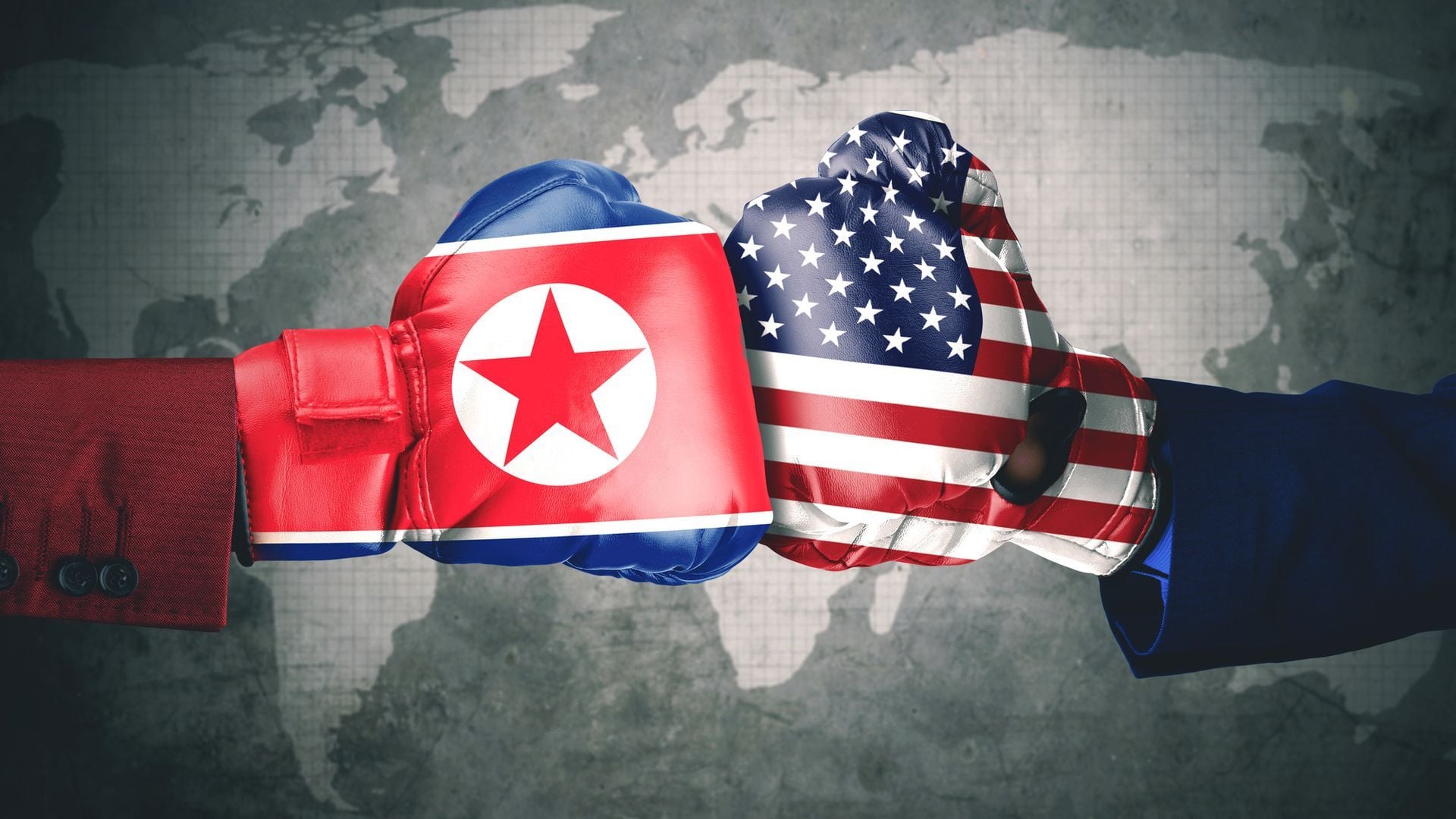 1. The Woe of the 5th Trumpet is Upon the World. Two boxing gloves striking each other, one colored with the North Korean flag and the other with the American flag, set against a faded global map background. Opens a video in a new window.