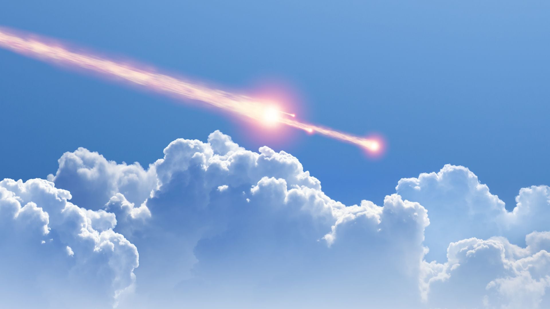 13. Ein Meteorit stürzt auf Kuba. A celestial body streaks across the sky above fluffy cumulus clouds, glowing with intense warmth and surrounded by a vast expanse of blue. Opens a video in a new window.