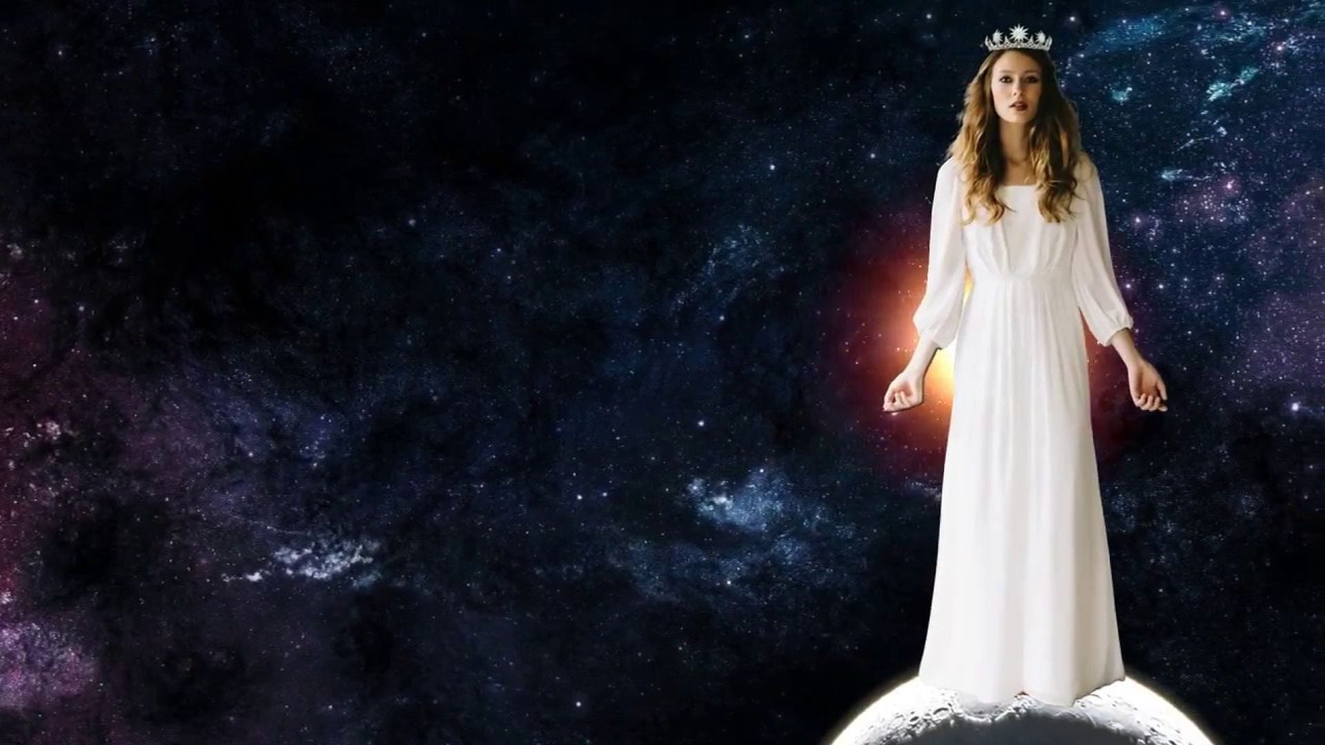 9. La mujer de Apocalipsis - tráiler. A woman in a flowing white gown and a tiara stands atop a crescent moon against a backdrop of a star-filled cosmic sky. Opens a video in a new window.